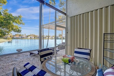 This spacious 1-story home offers serene water views from nearly on Woodmont Country Club in Florida - for sale on GolfHomes.com, golf home, golf lot
