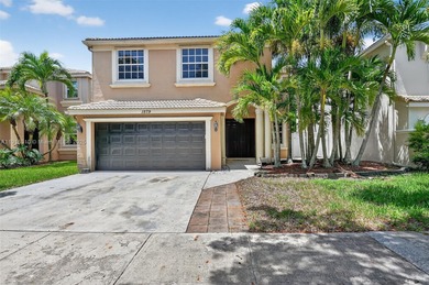 Spacious 5BR, 2.5BA home in Madison Green, Royal Palm Beach on The Links At Madison Green in Florida - for sale on GolfHomes.com, golf home, golf lot