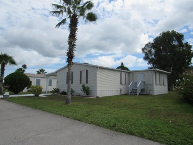 2005 Palm Harbor mobile home with a large (12x20) Florida room on Spanish Lakes Golf Village in Florida - for sale on GolfHomes.com, golf home, golf lot