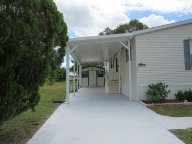 2005 Palm Harbor mobile home with a large (12x20) Florida room on Spanish Lakes Golf Village in Florida - for sale on GolfHomes.com, golf home, golf lot