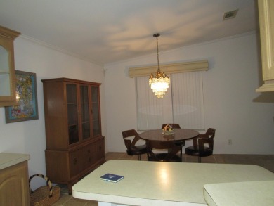 2005 Palm Harbor mobile home with a large (12x20) Florida room on Spanish Lakes Golf Village in Florida - for sale on GolfHomes.com, golf home, golf lot