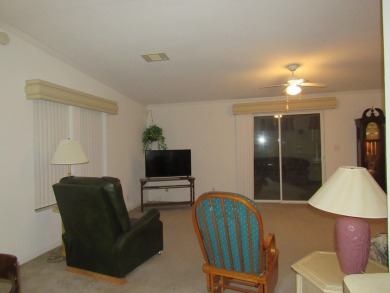 2005 Palm Harbor mobile home with a large (12x20) Florida room on Spanish Lakes Golf Village in Florida - for sale on GolfHomes.com, golf home, golf lot