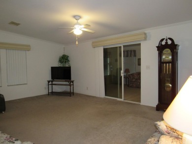 2005 Palm Harbor mobile home with a large (12x20) Florida room on Spanish Lakes Golf Village in Florida - for sale on GolfHomes.com, golf home, golf lot