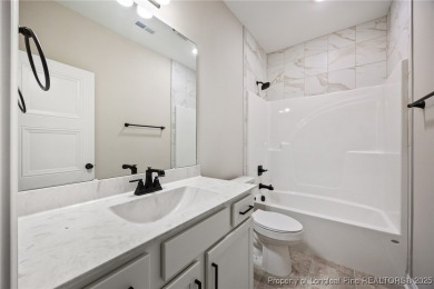 Discover your dream home where elegance meets functionality in a on Deercroft Golf and Country Club in North Carolina - for sale on GolfHomes.com, golf home, golf lot