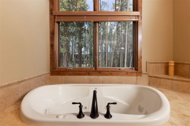This classic mountain home is set low off Highlands Drive on Breckenridge Golf Club in Colorado - for sale on GolfHomes.com, golf home, golf lot