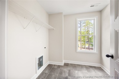 Discover your dream home where elegance meets functionality in a on Deercroft Golf and Country Club in North Carolina - for sale on GolfHomes.com, golf home, golf lot