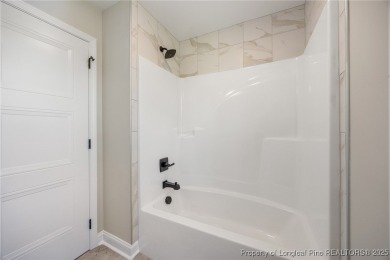 Discover your dream home where elegance meets functionality in a on Deercroft Golf and Country Club in North Carolina - for sale on GolfHomes.com, golf home, golf lot