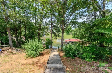 Waterfront living conveniently located near town! A home with a on Piney Point Golf Club in North Carolina - for sale on GolfHomes.com, golf home, golf lot