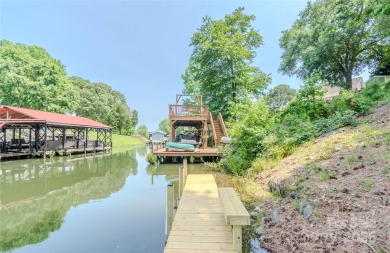 Waterfront living conveniently located near town! A home with a on Piney Point Golf Club in North Carolina - for sale on GolfHomes.com, golf home, golf lot
