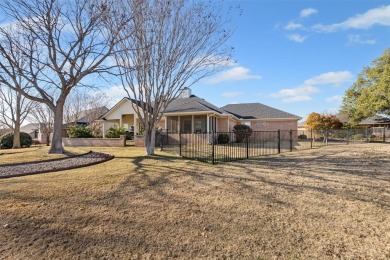 Welcome to your dream home located in the prestigious, gated on Pecan Plantation Country Club in Texas - for sale on GolfHomes.com, golf home, golf lot