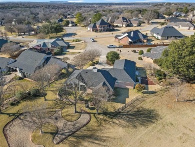 Welcome to your dream home located in the prestigious, gated on Pecan Plantation Country Club in Texas - for sale on GolfHomes.com, golf home, golf lot