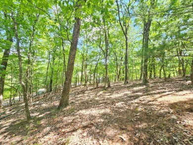 Nestled within the serene and exclusive Big Canoe community in on Big Canoe Golf Club - Cherokee in Georgia - for sale on GolfHomes.com, golf home, golf lot