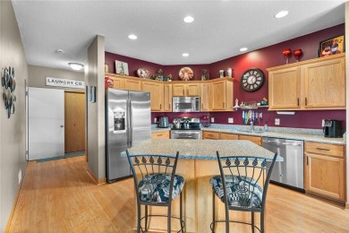 Welcome to this exceptional end-unit townhome that stands out on Oak Marsh Golf Club in Minnesota - for sale on GolfHomes.com, golf home, golf lot
