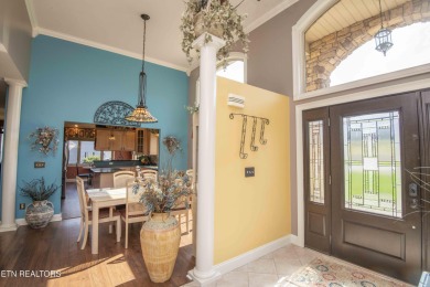 Golf course views, sun-filled rooms, and a massive 23x43 4-car on Tellico Village -The Links At Kahite Golf Course in Tennessee - for sale on GolfHomes.com, golf home, golf lot