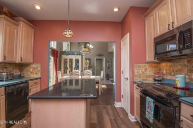 Golf course views, sun-filled rooms, and a massive 23x43 4-car on Tellico Village -The Links At Kahite Golf Course in Tennessee - for sale on GolfHomes.com, golf home, golf lot