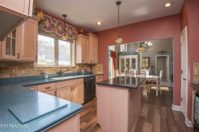 Golf course views, sun-filled rooms, and a massive 23x43 4-car on Tellico Village -The Links At Kahite Golf Course in Tennessee - for sale on GolfHomes.com, golf home, golf lot
