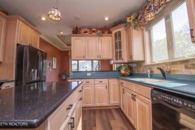 Golf course views, sun-filled rooms, and a massive 23x43 4-car on Tellico Village -The Links At Kahite Golf Course in Tennessee - for sale on GolfHomes.com, golf home, golf lot