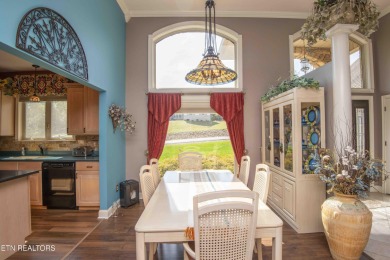 Golf course views, sun-filled rooms, and a massive 23x43 4-car on Tellico Village -The Links At Kahite Golf Course in Tennessee - for sale on GolfHomes.com, golf home, golf lot