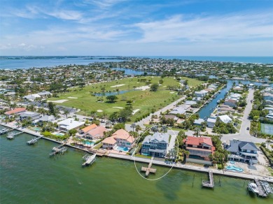 Welcome to your luxury oasis overlooking the serene waters of on Key Royale Club in Florida - for sale on GolfHomes.com, golf home, golf lot