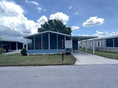 2 bed | 2 bath | 864 sq ft - Handyman's Special in Highly on Lake Henry Golf Club in Florida - for sale on GolfHomes.com, golf home, golf lot