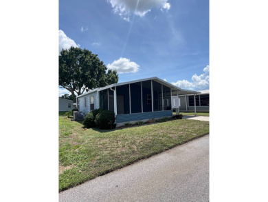 2 bed | 2 bath | 864 sq ft - Handyman's Special in Highly on Lake Henry Golf Club in Florida - for sale on GolfHomes.com, golf home, golf lot