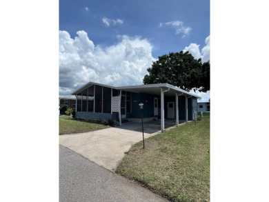 2 bed | 2 bath | 864 sq ft - Handyman's Special in Highly on Lake Henry Golf Club in Florida - for sale on GolfHomes.com, golf home, golf lot
