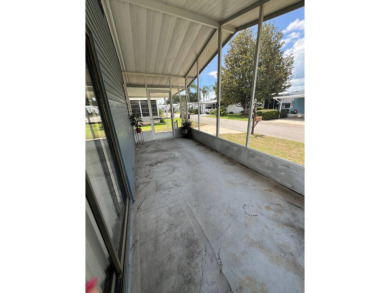 2 bed | 2 bath | 864 sq ft - Handyman's Special in Highly on Lake Henry Golf Club in Florida - for sale on GolfHomes.com, golf home, golf lot