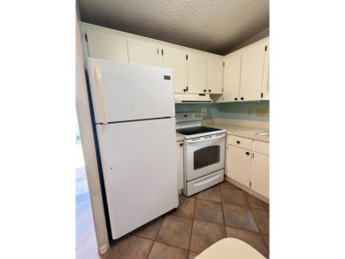 2 bed | 2 bath | 864 sq ft - Handyman's Special in Highly on Lake Henry Golf Club in Florida - for sale on GolfHomes.com, golf home, golf lot
