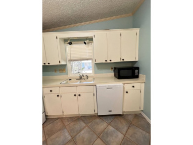 2 bed | 2 bath | 864 sq ft - Handyman's Special in Highly on Lake Henry Golf Club in Florida - for sale on GolfHomes.com, golf home, golf lot