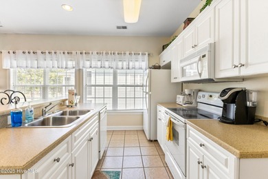Discover easy coastal living in this spacious condo located in on Sea Trail Golf Resort in North Carolina - for sale on GolfHomes.com, golf home, golf lot