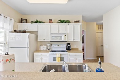 Discover easy coastal living in this spacious condo located in on Sea Trail Golf Resort in North Carolina - for sale on GolfHomes.com, golf home, golf lot