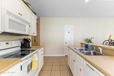 Discover easy coastal living in this spacious condo located in on Sea Trail Golf Resort in North Carolina - for sale on GolfHomes.com, golf home, golf lot