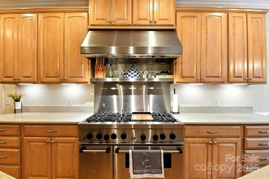 Stunning executive brick home in the gated Rock Barn Golf on Rock Barn Golf and Spa in North Carolina - for sale on GolfHomes.com, golf home, golf lot
