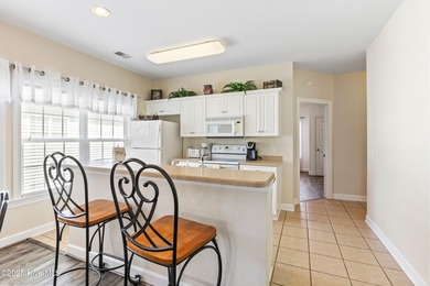 Discover easy coastal living in this spacious condo located in on Sea Trail Golf Resort in North Carolina - for sale on GolfHomes.com, golf home, golf lot