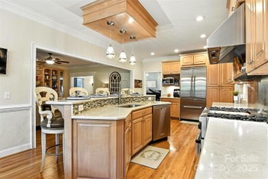 Stunning executive brick home in the gated Rock Barn Golf on Rock Barn Golf and Spa in North Carolina - for sale on GolfHomes.com, golf home, golf lot