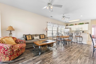 Discover easy coastal living in this spacious condo located in on Sea Trail Golf Resort in North Carolina - for sale on GolfHomes.com, golf home, golf lot
