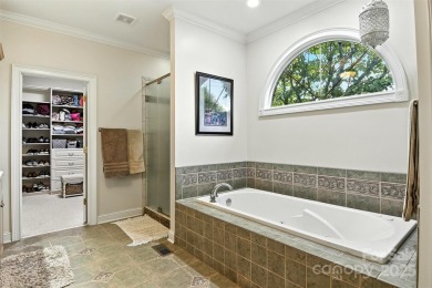 Stunning executive brick home in the gated Rock Barn Golf on Rock Barn Golf and Spa in North Carolina - for sale on GolfHomes.com, golf home, golf lot