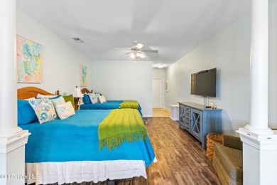 Discover easy coastal living in this spacious condo located in on Sea Trail Golf Resort in North Carolina - for sale on GolfHomes.com, golf home, golf lot