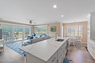 Expansive golf and water views abound in this spacious condo on Oyster Bay Golf Links in North Carolina - for sale on GolfHomes.com, golf home, golf lot
