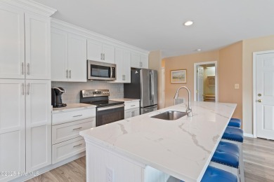 Expansive golf and water views abound in this spacious condo on Oyster Bay Golf Links in North Carolina - for sale on GolfHomes.com, golf home, golf lot