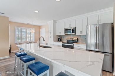 Expansive golf and water views abound in this spacious condo on Oyster Bay Golf Links in North Carolina - for sale on GolfHomes.com, golf home, golf lot