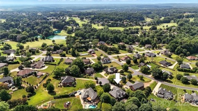 Stunning executive brick home in the gated Rock Barn Golf on Rock Barn Golf and Spa in North Carolina - for sale on GolfHomes.com, golf home, golf lot