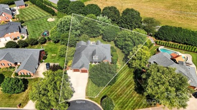 Stunning executive brick home in the gated Rock Barn Golf on Rock Barn Golf and Spa in North Carolina - for sale on GolfHomes.com, golf home, golf lot