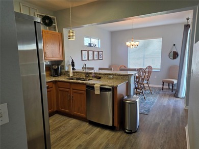 This 2-bedroom, 2-bath Amelia model home in Del Webb Spruce on Eagle Ridge At Spruce Creek Country Club in Florida - for sale on GolfHomes.com, golf home, golf lot