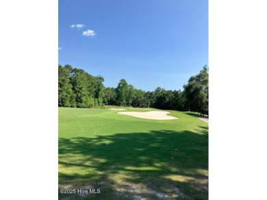 This golf course lot looks down the first fairway of the Ibis on Carolina National Golf Club in North Carolina - for sale on GolfHomes.com, golf home, golf lot