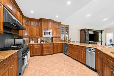 Exceptional 6BR/3-2hb stunning residence nestled on a corner lot on TPC Eagle Trace in Florida - for sale on GolfHomes.com, golf home, golf lot