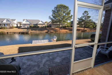 This beautifully maintained, custom canal-front home in on Magnolia Greens Golf Plantation in North Carolina - for sale on GolfHomes.com, golf home, golf lot