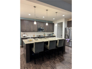 This stunning end-unit townhome in the Magnolia Green community on The Westham Golf Club At Magnolia Green in Virginia - for sale on GolfHomes.com, golf home, golf lot