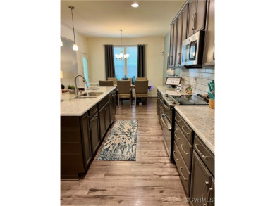 This stunning end-unit townhome in the Magnolia Green community on The Westham Golf Club At Magnolia Green in Virginia - for sale on GolfHomes.com, golf home, golf lot