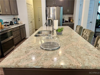 This stunning end-unit townhome in the Magnolia Green community on The Westham Golf Club At Magnolia Green in Virginia - for sale on GolfHomes.com, golf home, golf lot